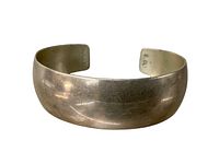 Front view of wide Sterling silver cuff bracelet showing smooth surface and gentle curve.