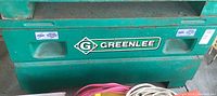 Front view of green job box showing Greenlee logo and handles