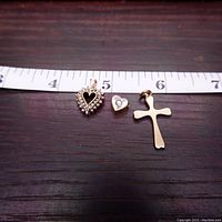Three pendants on wood surface with inch scale