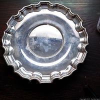 Top view of one scalloped edge plate showing overall shape and rim detail