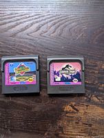 Two Sega Game Gear cartridges: World Series Baseball and Jurassic Park