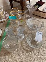 Overall group of twelve glass pieces arranged on floor