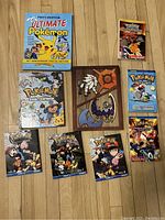 All 9 Pokémon books displayed on floor with covers visible.