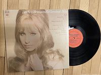 Front cover of Barbra Streisand's Greatest Hits vinyl record showing sepia-toned photo and song titles
