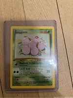Front of 1st Edition Exeggcute card showing details including HP, attacks, and 1st Edition symbol.