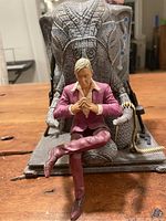 Front view of resin collectible showing Pagan Min seated on ornate elephant throne with detailed paint and textures