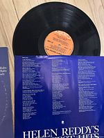 Vinyl record showing orange Capitol label and black grooves, with visible good condition.