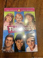 Front of the Full House The Complete First Season DVD box showing cast photos and title with sealed plastic wrap.