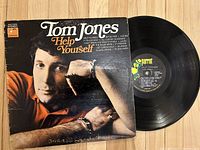 Front cover and vinyl record showing Tom Jones and album title 'Help Yourself' with Parrot label on record.