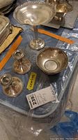All four sterling pieces on table