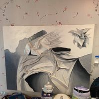 Front view of 3D canvas wall art showing the textured abstract design with folding and fabric-like elements in white, gray, and black.