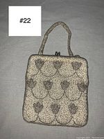 Front side of the vintage 1950s evening bag showing detailed silver bead tulip pattern