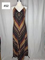 Front view of vintage 1970s chevron halter summer dress showing diamond pattern and halter neckline.
