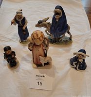 Photo showing five Goebel nativity figures on a white background with a MaxSold lot card