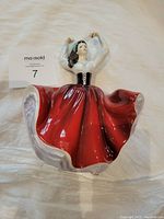 Photo of Royal Doulton porcelain figurine "Karen" showing front view with details of dress and pose.