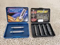 Black SpeedOut plastic case open showing five silver screw removal bits of various sizes