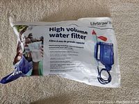 Front view of sealed LifeStraw High Volume Water Filter packaging, showing product details and image of the filter unit