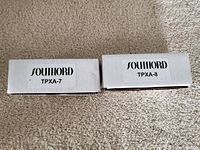 Two white boxes labeled Southord TPXA-7 and TPXA-8, showing model names and brand labels.