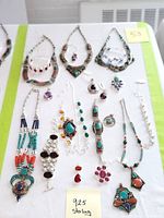Lot overview showing all jewelry items arranged on white background