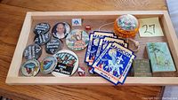 Top-down photo of all items in lot displayed in wooden tray