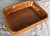 Top view of rectangular brown glazed casserole dish showing interior and rim shape.
