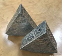 Top side view showing the unique textured surface and triangular prism shape of the pewter salt and pepper shakers.