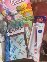 Photo of assorted Easter items including a Classic Bunny Candy Box with pastel-colored eggs and chicks.