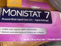 Close-up of Monistat 7 box showing product name and key details including the indication as vaginal antifungal cream and 7-day treatment.