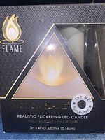 Box front showing the Motion Flame brand and realistic flickering LED candle with dimensions 3in x 4in.