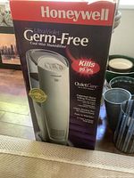Box front showing Honeywell Ultra Violet Germ-Free Cool Mist Humidifier branding and features including killing 99.9% of germs.