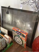 Lionel Train Clock in original packaging with clock face and rotating train feature indicated on box.