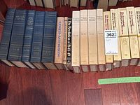 Row of blue Marx Capital volumes and Engels Anti-Dühring with turquoise revolution book and four International Working Class Movement volumes