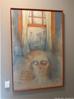 Full front view of framed original art showing a woman's portrait with cityscape in background