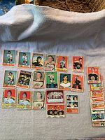 Overhead shot of a selection of Bruins player cards and a small stack of additional cards