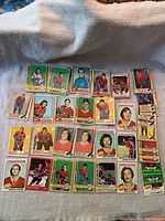 Flat lay of 27 Montreal Canadiens hockey cards from OPC 1969-1976 including various player portraits and action shots.