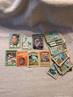 Image showing individual baseball cards laid out including Felipe Alou, Willie Stargell, Brooks Robinson, various teams, and a scratch off card.