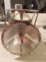 Front view showing reflector and glass globe on the vintage Delta Powerlight lantern.