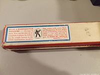 Photo of the side panel of the original harmonica box showing promotional text about learning to play with instructional booklet.