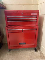 Front view of red Craftsman two-piece tool chest with casters
