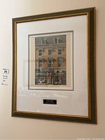 Framed print of 44 Yonge Street in ornate frame with plaque.