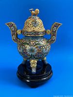 Full front view of cloisonne censer mounted on wooden stand