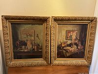 Both prints in their gilded ornate frames side by side, showing full view of artwork and frame details