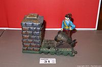 Full view of vintage cast iron artillery bank showing soldier figure, cannon, and brick chimney.