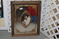 Frontal image of the vintage Elvis Presley mirror showing the gold decorative etching and the central image of Elvis.