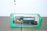Side view of 2000 Miniature Hess First Truck Gasoline Tanker in original box with clear plastic window, truck visible inside.