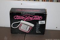 Original box of the Glow Talk neon glow telephone, showing box condition and design.