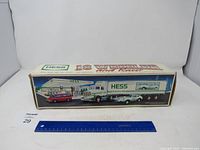 Original box showing the Hess 18 Wheeler and Racer set with truck and white race car depicted on the side.