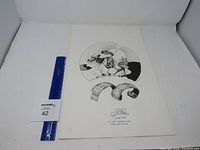 Full view of the signed and numbered military print with a ruler for scale.