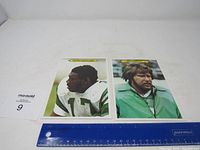 Two large Philadelphia Eagles Topps football cards with a ruler for size reference, worn but in good condition.