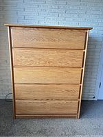 Full view of solid oak 5-drawer dresser chest with Salem color finish, showing front and drawer fronts.